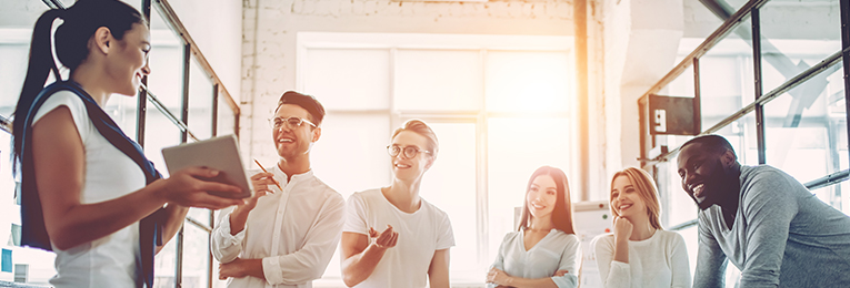 we can see six people at a casual discussion at a office space